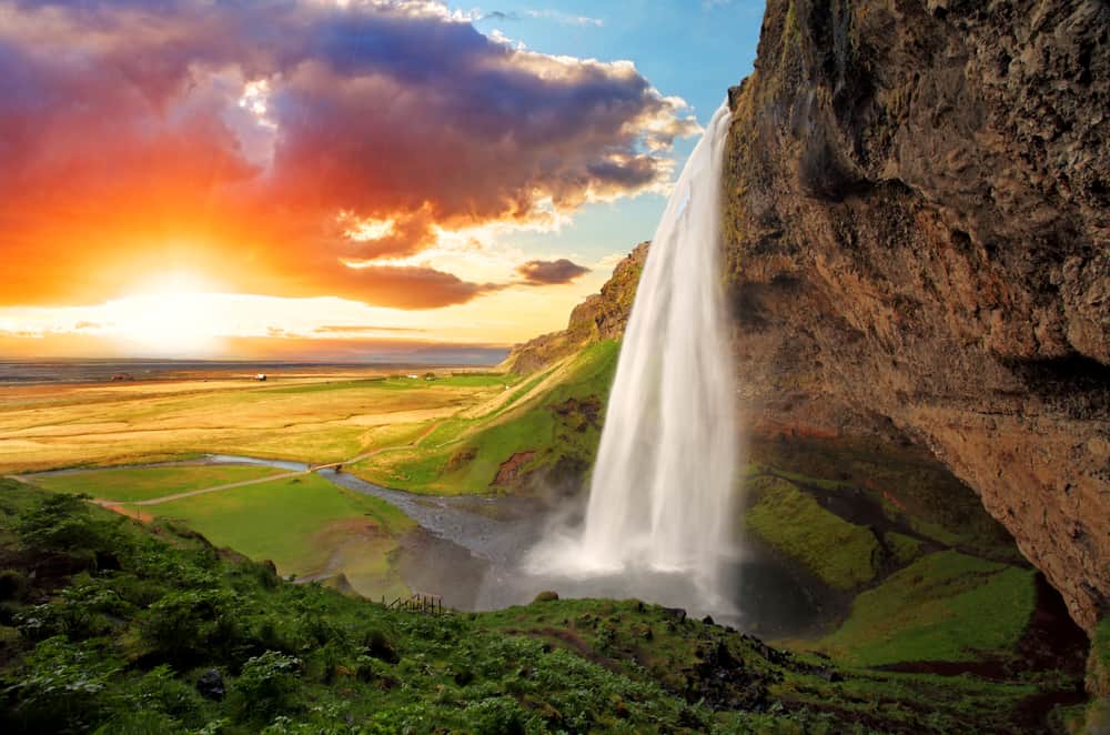 Seljalandsfoss is one of the most beautiful waterfalls in Iceland.  It is located in the south of the island.  With a rainbow.